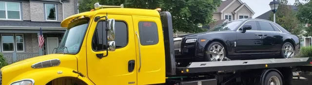 photo of flatbed towing services being rendered in Suffulk County NY